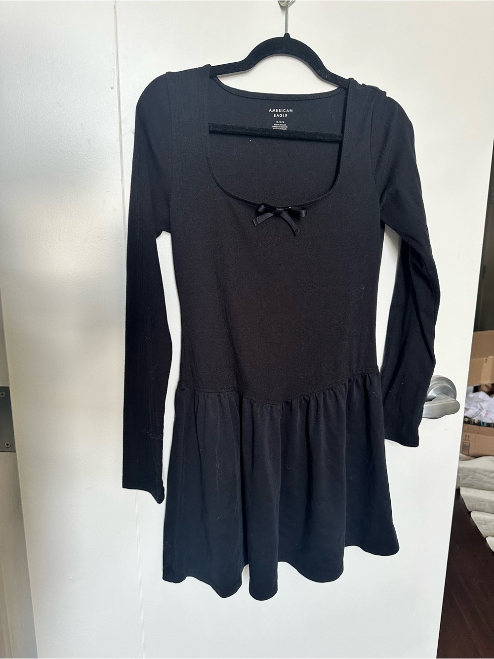 American Eagle Black Long Sleeve Peplum Dress with subtle lace pattern